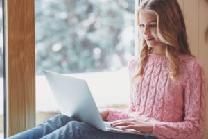 Teenage girl with gadget