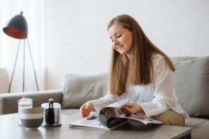 Woman reading on the couch at home